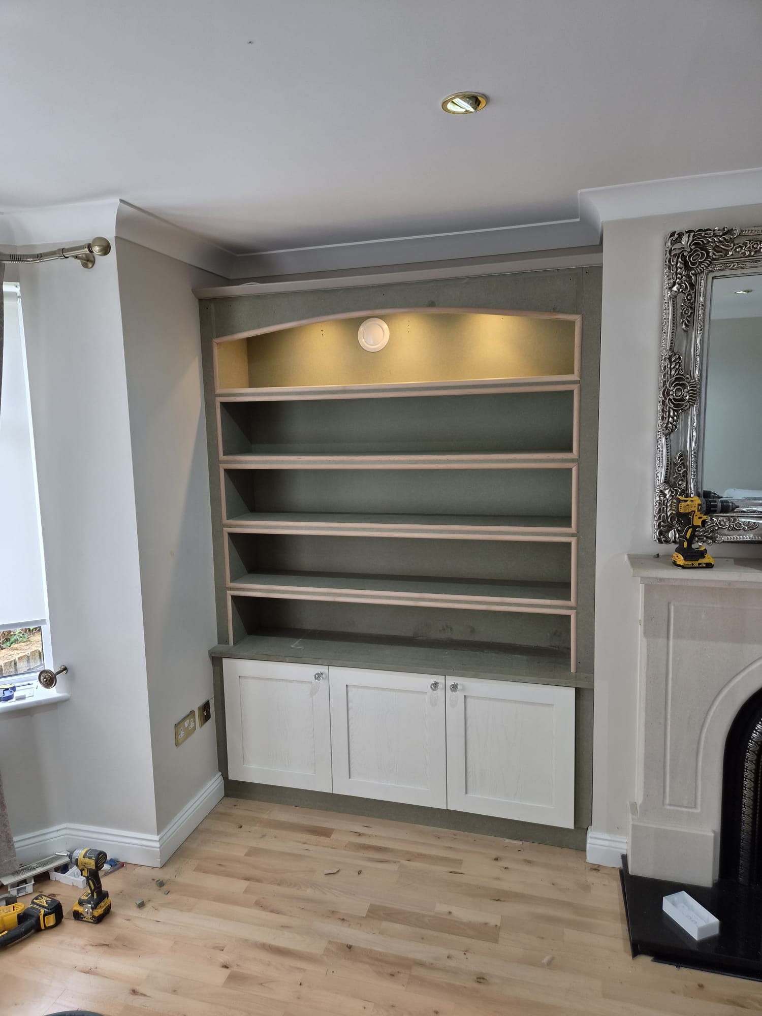 Alcove cabinetry resprayed in soft grey — before