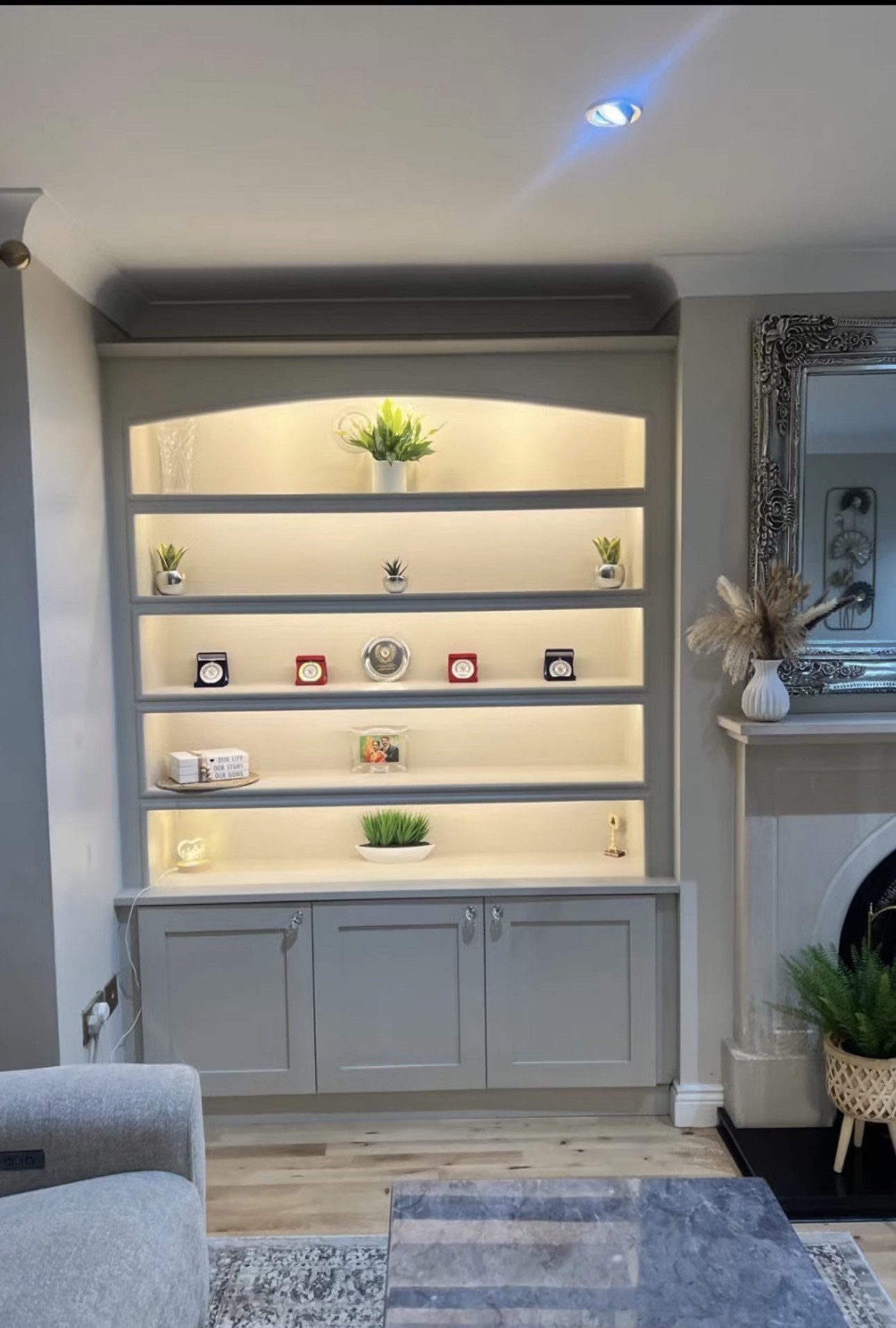 Alcove cabinetry resprayed in soft grey — after