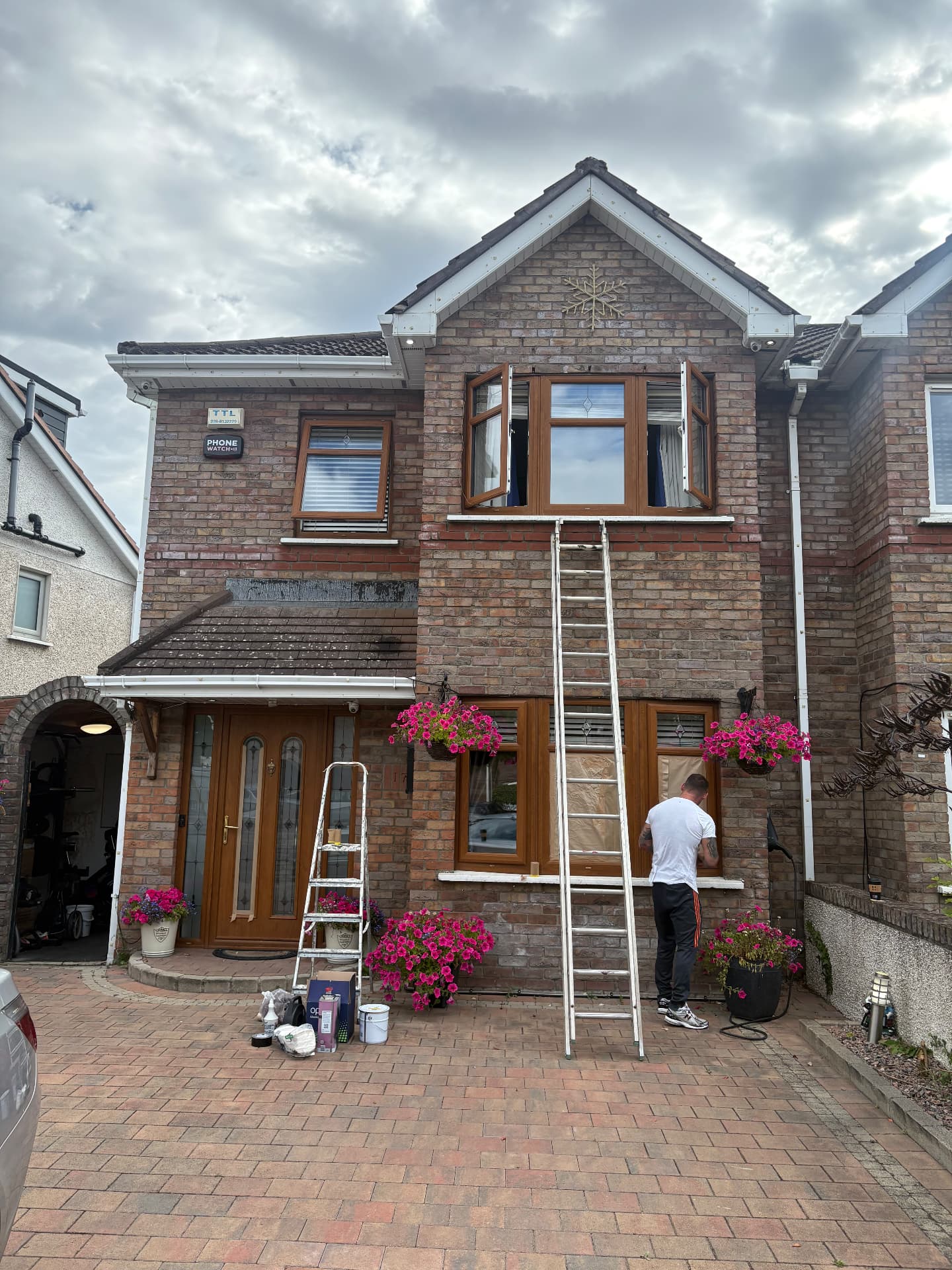 Woodgrain uPVC resprayed in anthracite grey — before