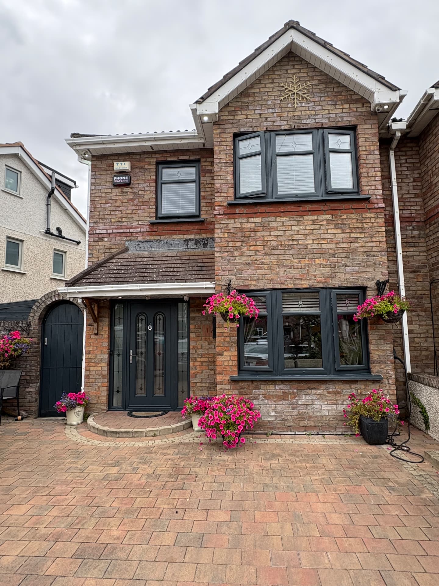 Woodgrain uPVC resprayed in anthracite grey — after